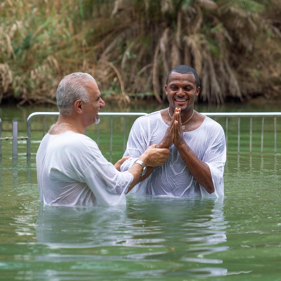NFL quarterback Deshaun Watson is baptized in the Jordan River. Photo courtesy America's Voices in Israel