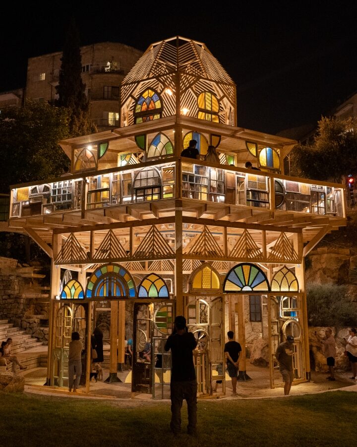 “Window Stories,” a temporary installation made of 550 salvaged windows, in Jerusalem’s Gan HaSus. Photo by Daniel Hanoch