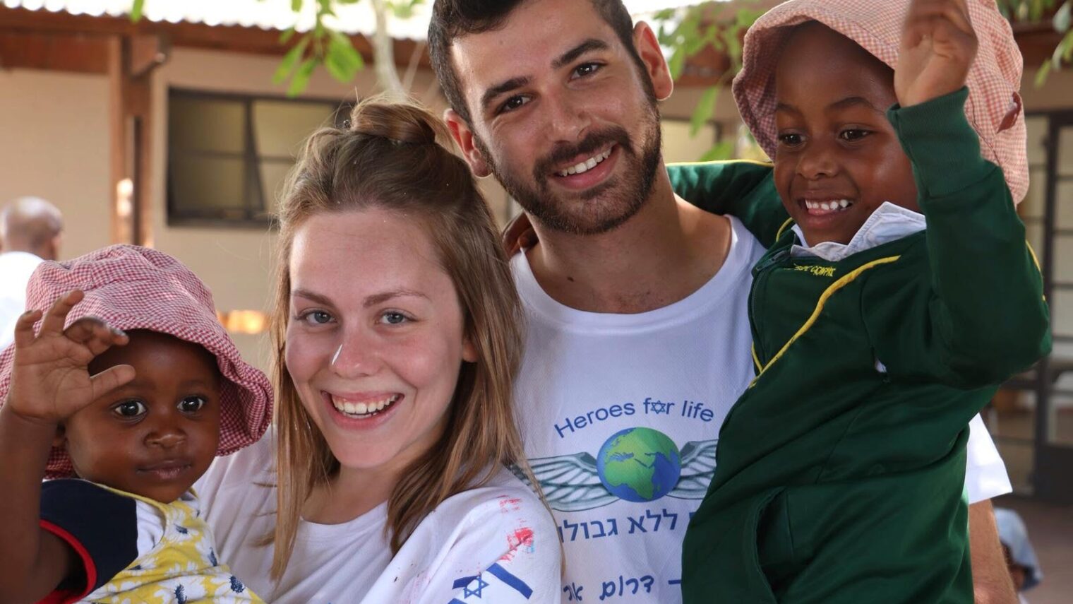 Heroes for Life volunteers OfirShalgy and Guy Arnon with children at a South African orphanage. Photo: courtesy