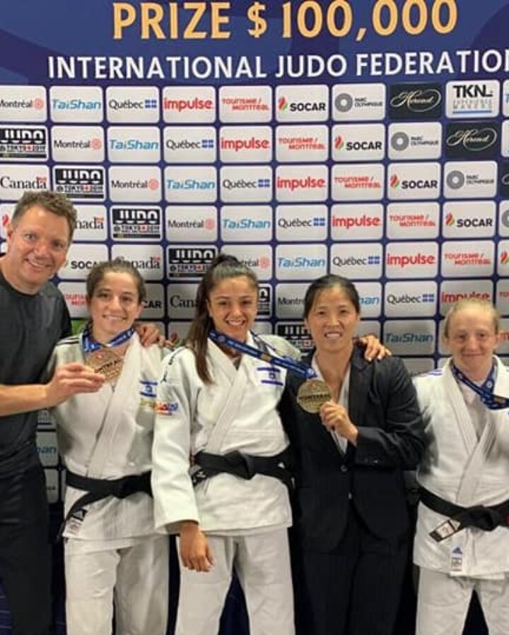 Israeli judokas Timna Nelson-Levy, Gefen Primo and Shira Rishony showing off their medals in Montreal. At left is the Israel Womenâ€™s Judo team coach, Shany Hershko. Photo courtesy of Israeli Judo Association