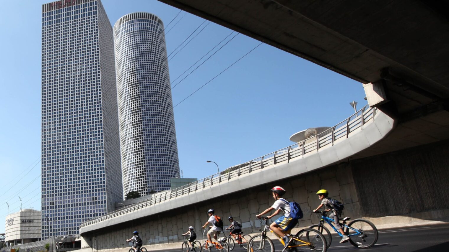 Israelis ride their bicycles along the empty Ayalon Highway in Tel Aviv on Yom Kippur. Photo by Chen Leopold/Flash 90