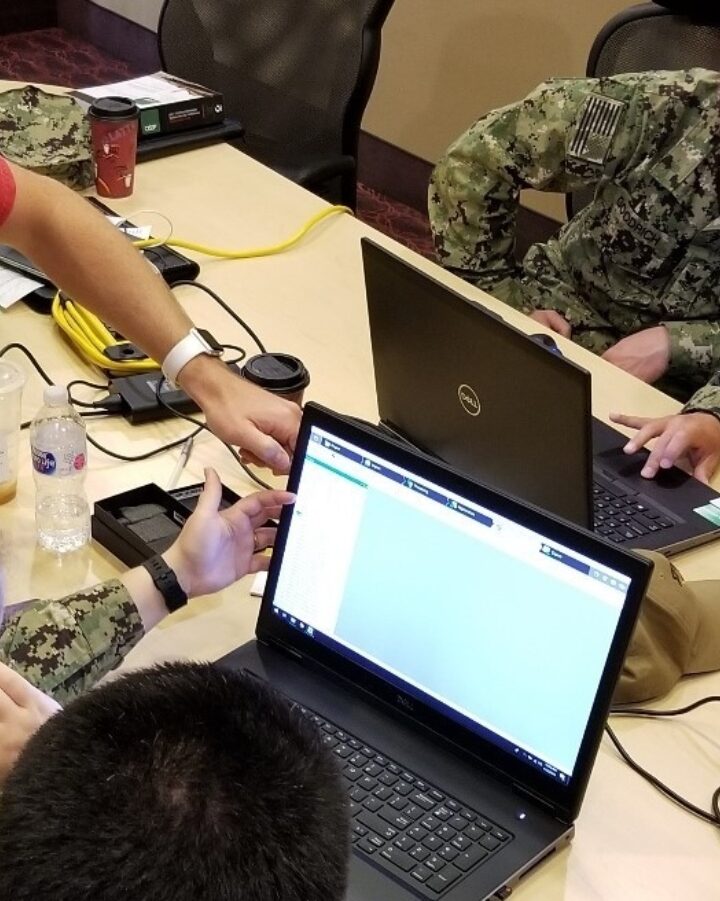 Sailors from the US Navy’s Space and Naval Warfare Systems Command Reserve Program Configuration Validation Team working with the Naval Information Warfare Center Pacific's RESTORE Lab in Bremerton, Washington, April 2019. Photo by Cmdr. John P Fagan/US Navy