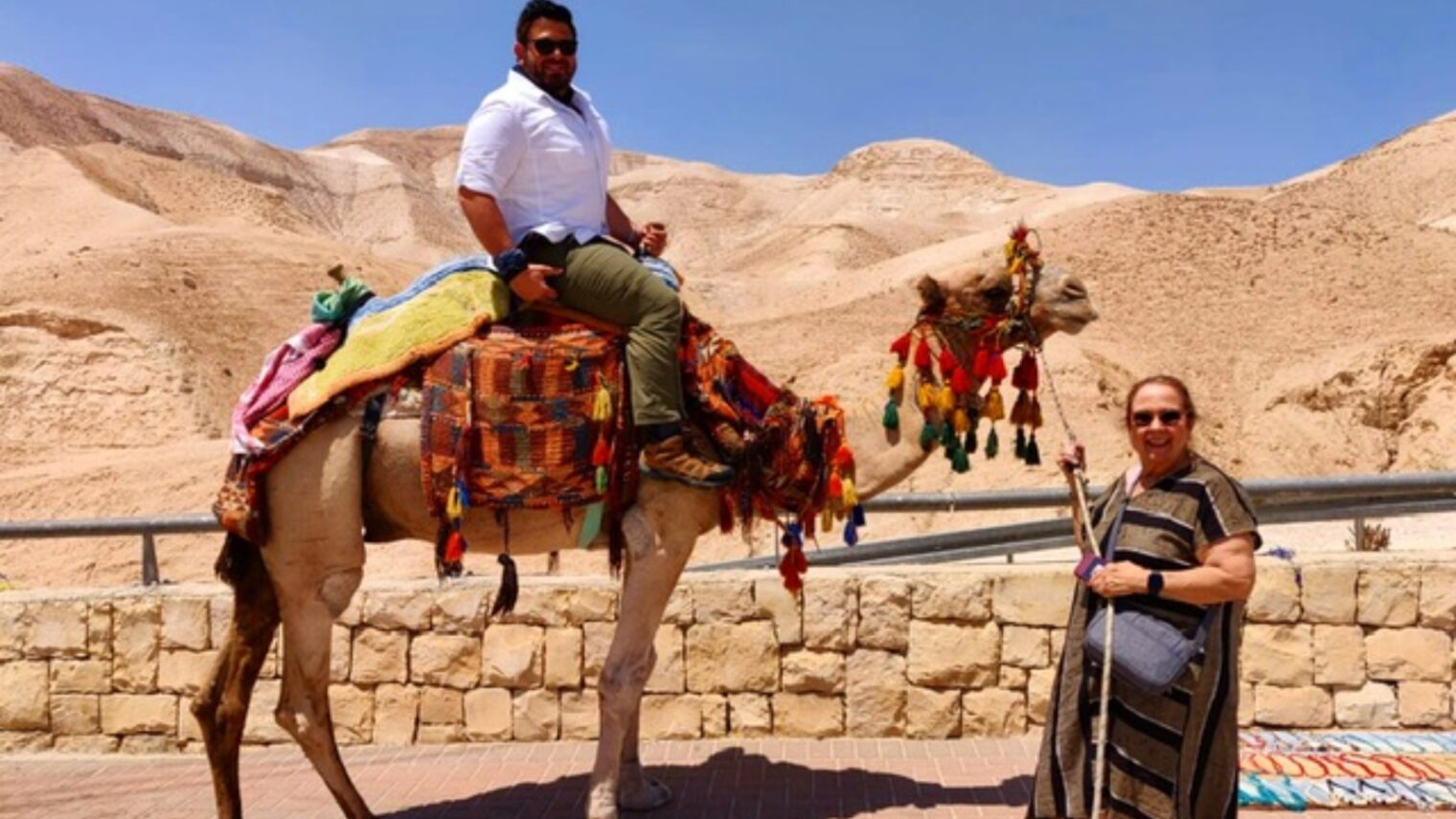Sharon Richman and her son, Adam, on a camel ride in Israel. Photo: courtesy