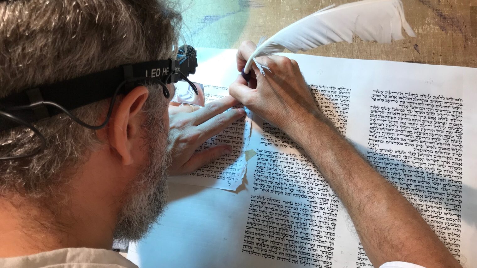 Jerusalem scribe Jamie Shear writing a Torah scroll. Photo by Abigail Klein Leichman