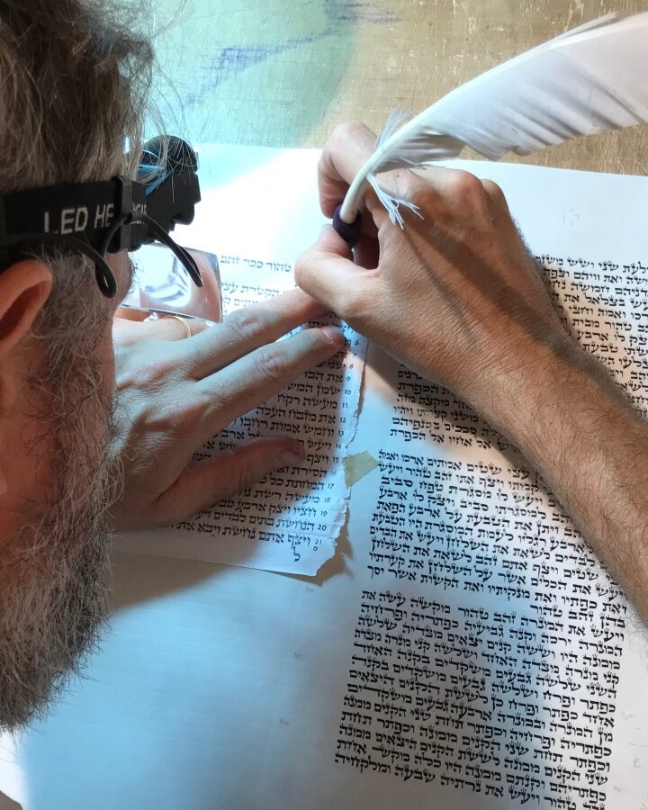 Jerusalem scribe Jamie Shear writing a Torah scroll. Photo by Abigail Klein Leichman