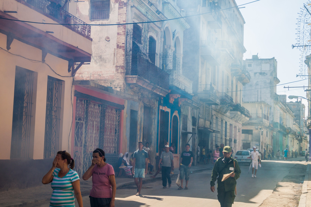 A Havana neighborhood being fumigated as a part of the fight against mosquitos carrying Zika virus in 2016. Photo by Matyas Rehak via Shutterstock.com