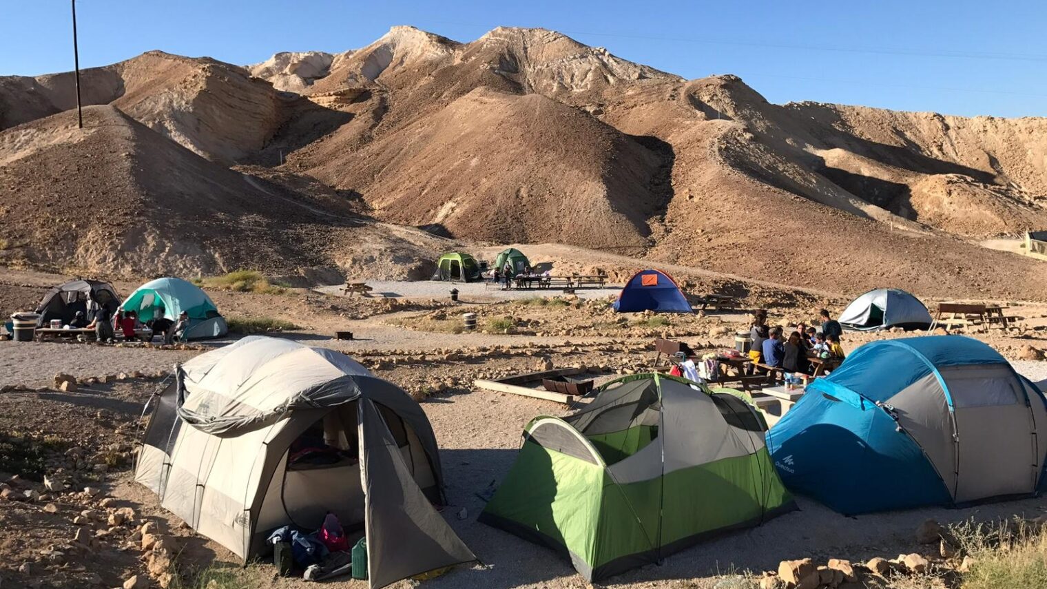 Pitch a tent at the foot of the majestic Masada mountain for a unique Israeli experience. Photo by Limor Katan Friedman/Israel Nature and Parks Authority