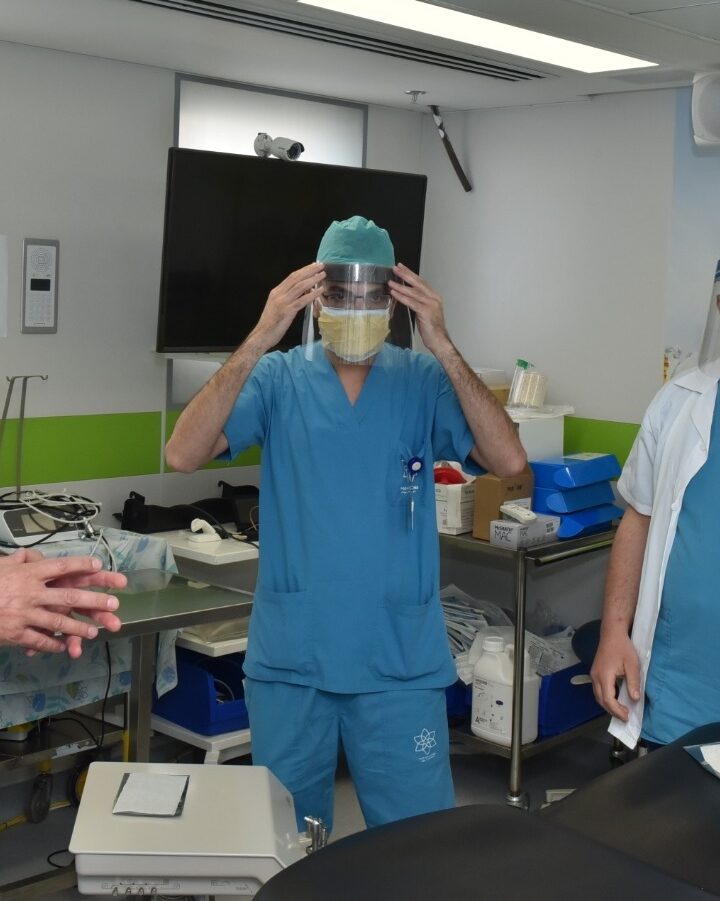 Dr. Samer Srouji, left, and members of his oral & maxillofacial surgery team at Galilee Medical Center testing the Maya sticker on their surgical masks. Photo by Eli Cohen
