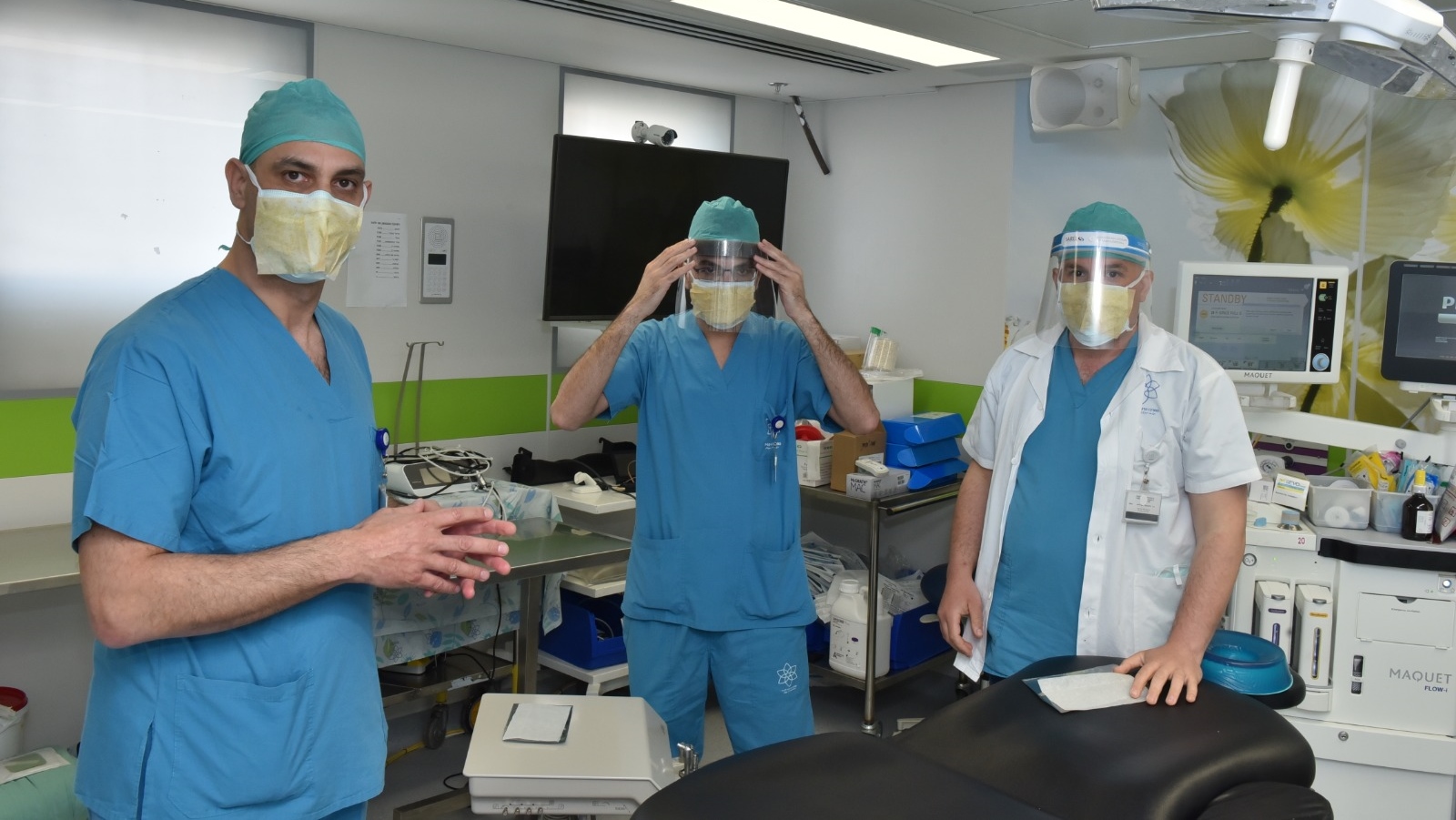 Dr. Samer Srouji, left, and members of his oral & maxillofacial surgery team at Galilee Medical Center testing the Maya sticker on their surgical masks. Photo by Eli Cohen