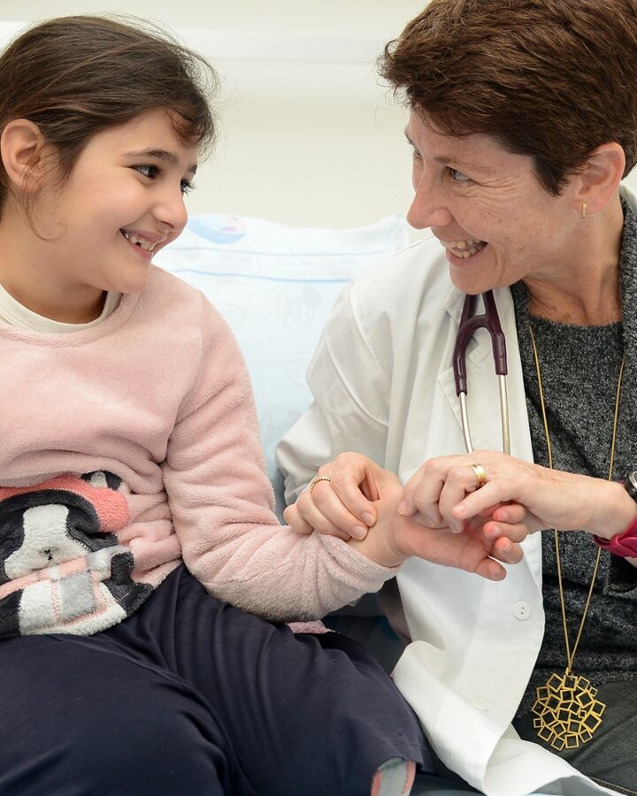 Dr. Gali Stoffman taking the pulse of a young patient at Barzilai Medical Center, Ashkelon. Photo: courtesy