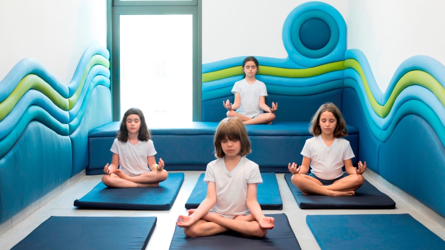 Children in Tel Aviv’s Bikurim inclusive school practice yoga in an award-winning space designed by Sarit Shani Hay. Photo by Roni Cnaani