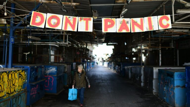 A message of hope decorates the empty Carmel Market in Tel Aviv. Photo by Tomer Neuberg/Flash90