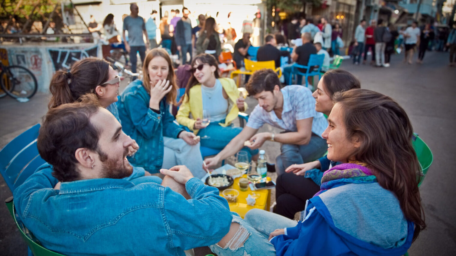 Friends share a picnic in Levinsky Market. Photo courtesy of Tel Aviv Municipality