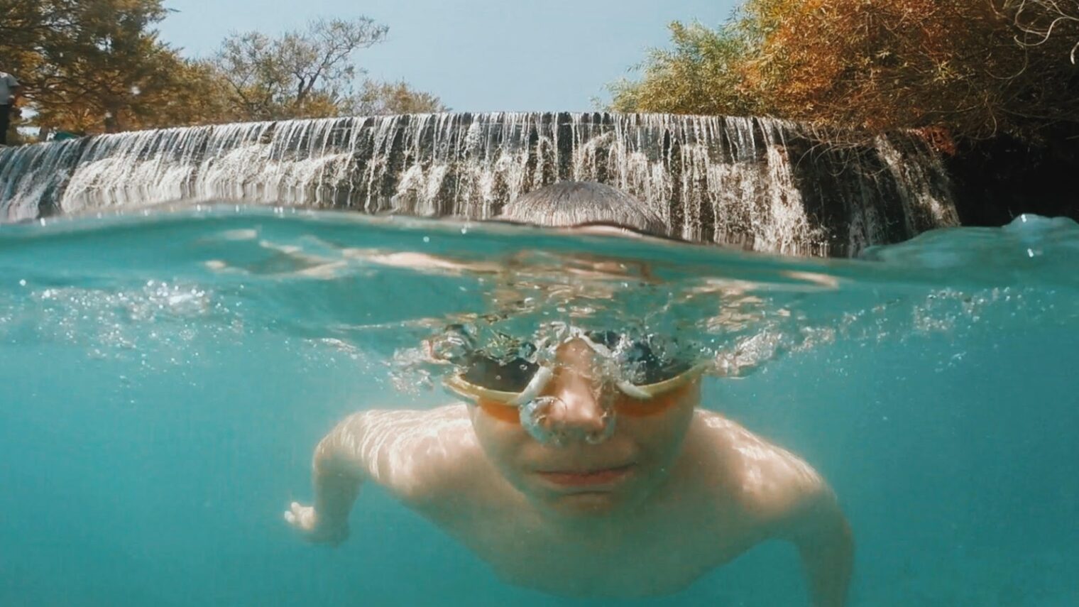 A young swimmer enjoying the springs at Gan HaShlosha National Park. Photo by Dina Alfasi