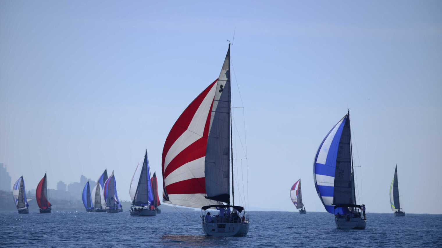 Sailors take to their yachts in an Israeli Sailing Competition along the Tel-Aviv shoreline. Photo by Tomer Neuberg/Flash90