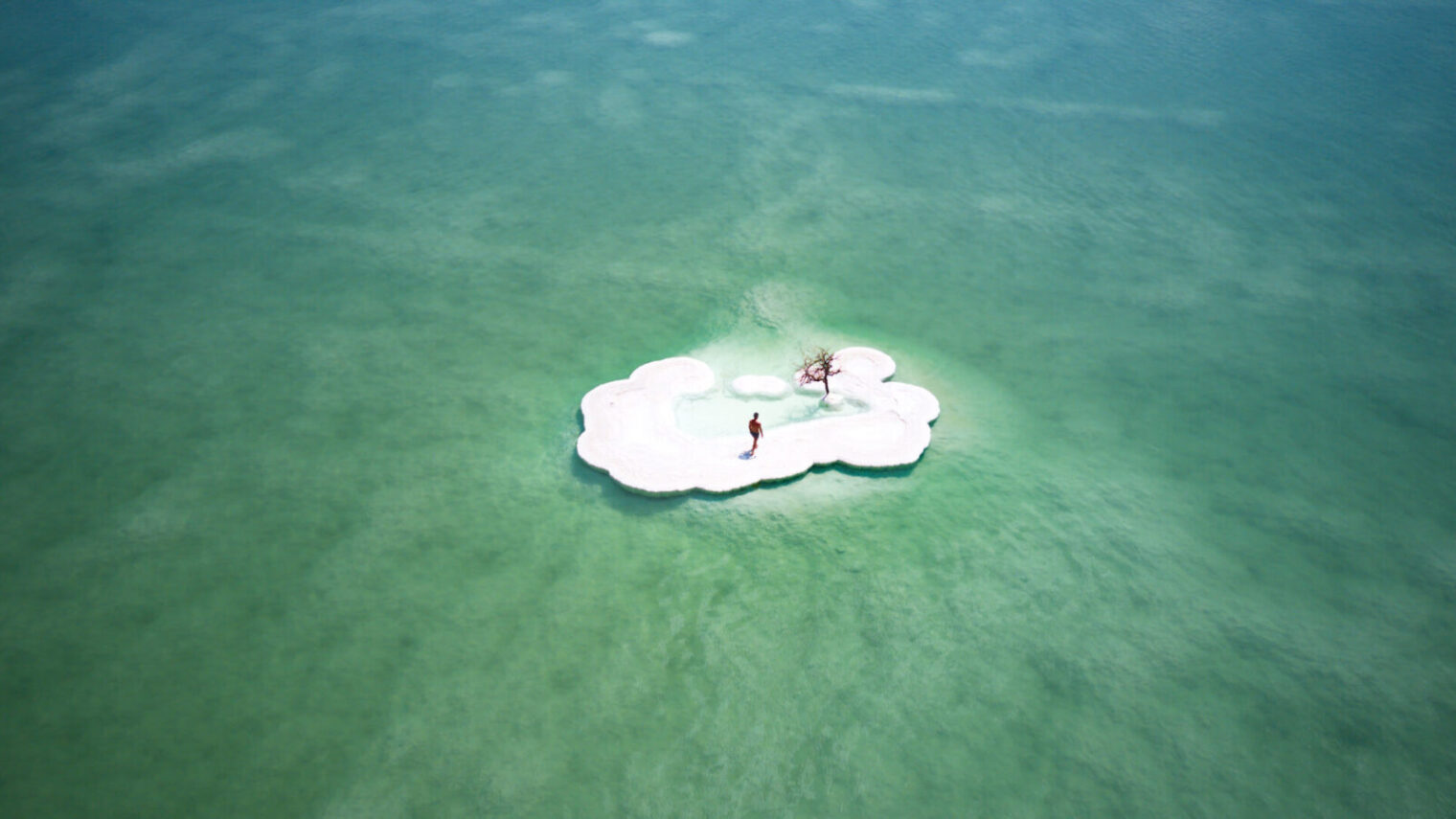 Aerial view of tourists and Israelis enjoying the Dead Sea. Photo by Menachem Lederman/Flash90