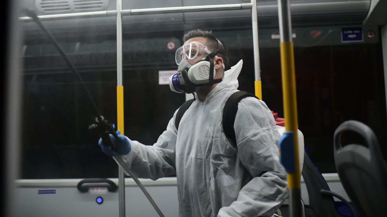 A worker disinfects a bus as a preventive measure amid fears over the spread of the coronavirus in Tel Aviv on March 9, 2020. Photo by Tomer Neuberg/Flash90