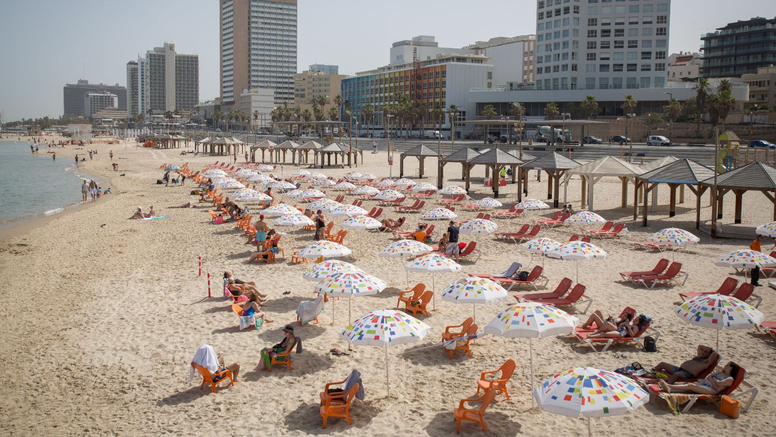 Israelis enjoy Tel Aviv’s seaside as the beaches are officially opened, on May 20, 2020. Photo by Miriam Alster/Flash90