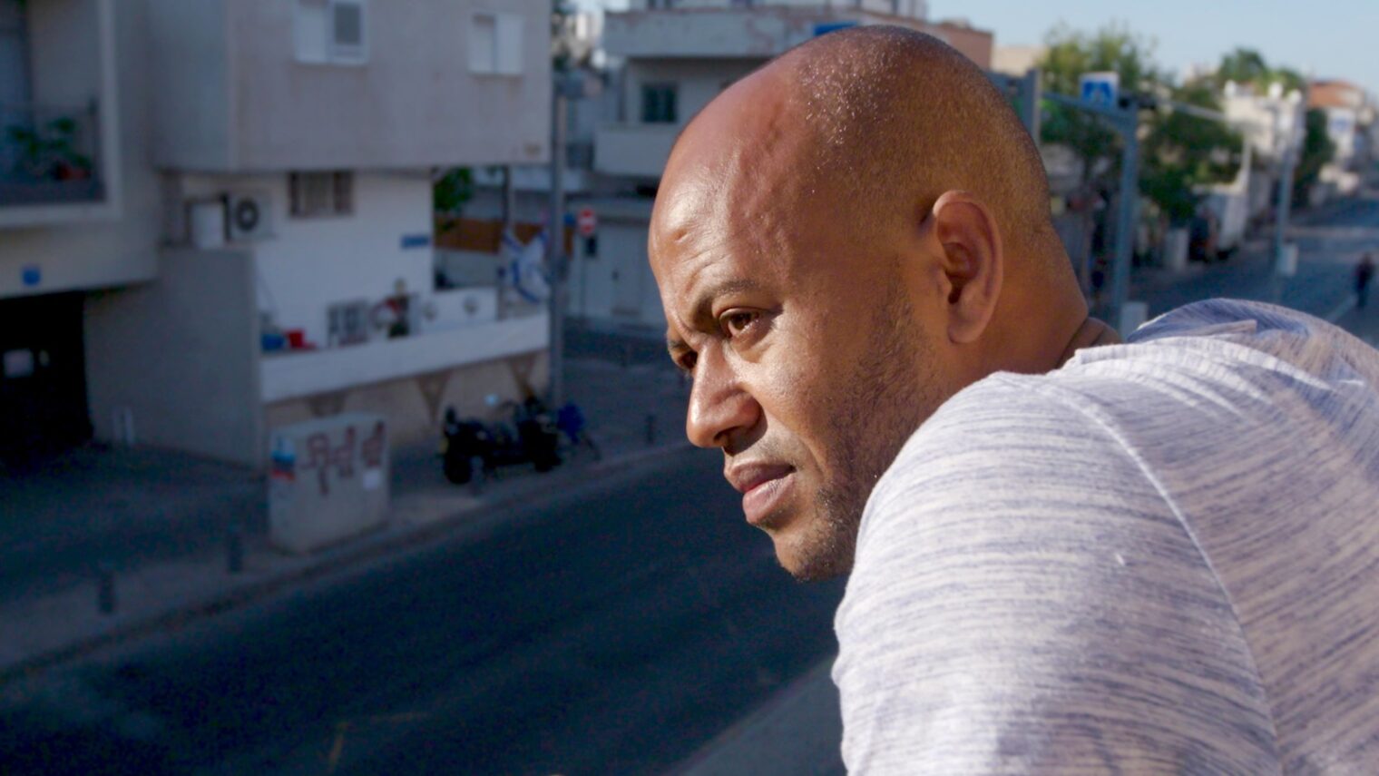 Eritrean asylum seeker Mogos Kidane Tewelde in Tel Aviv. Still from “My Year of Living Mindfully” courtesy of shannonharvey.com