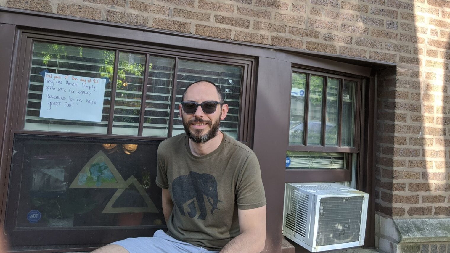 Yair Bernstein outside his Chicago apartment where he displays his daily dad jokes. (Courtesy)