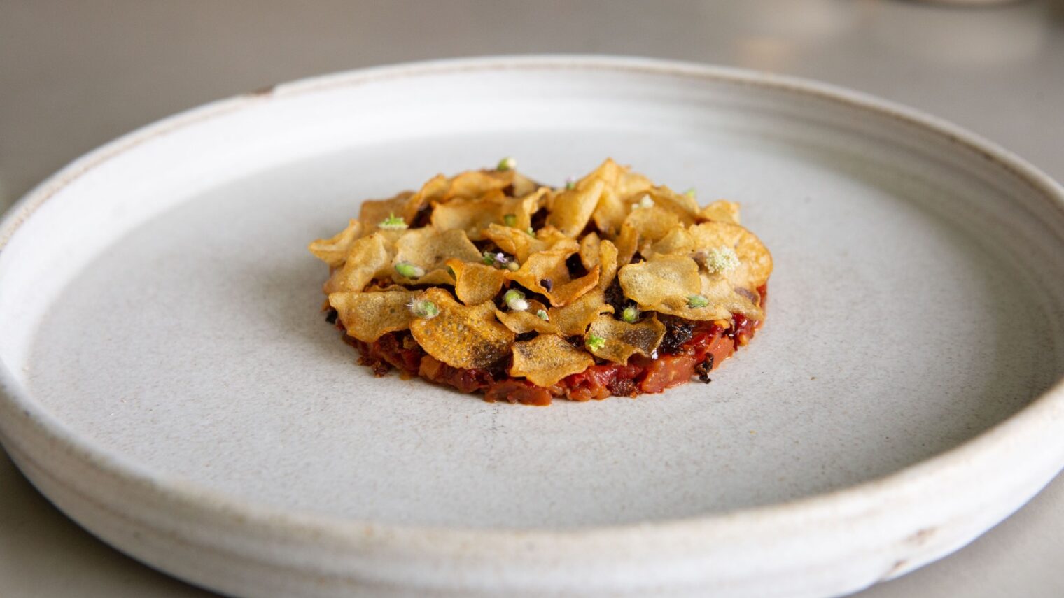 An Opa dish composed of tomato, shallots, berries, lemon and basil. Photo by Aviv Shkury