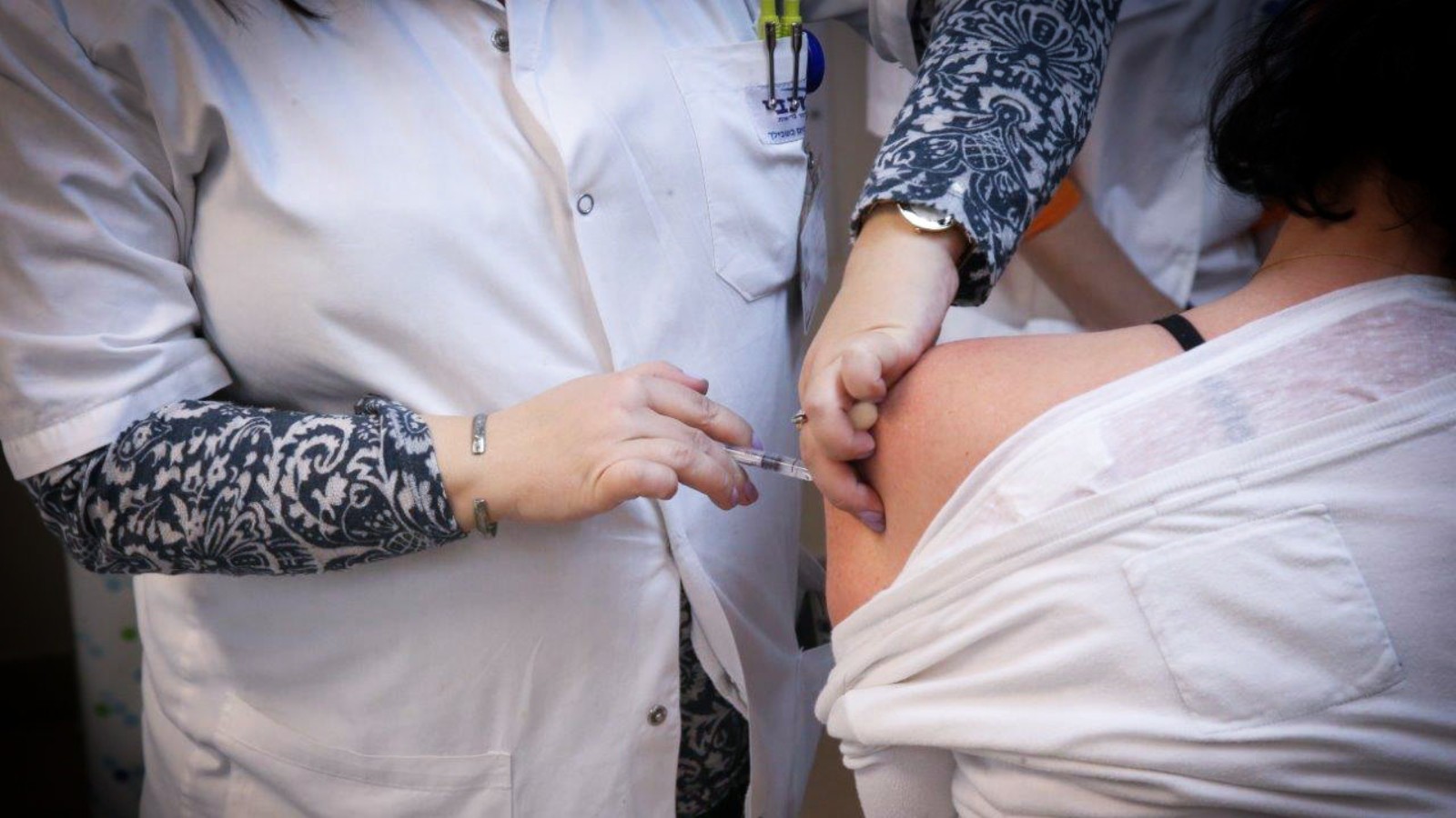 An Israeli woman getting a flu shot. Photo by FLASH90