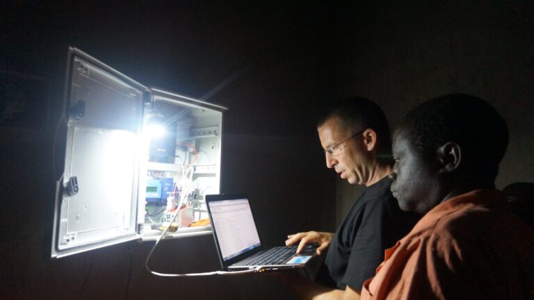 An Innovation: Africa engineer showing the Energy Box to a local technician. Photo: courtesy