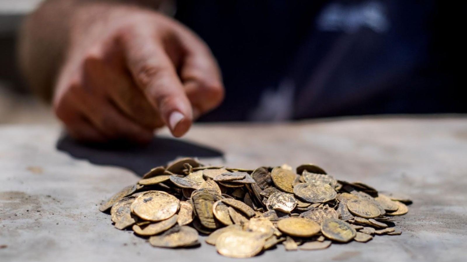 Pure gold coins in mint condition were recently unearthed in an undisclosed location in central Israel. Photo by Yoli Schwartz/Israel Antiquities Authority