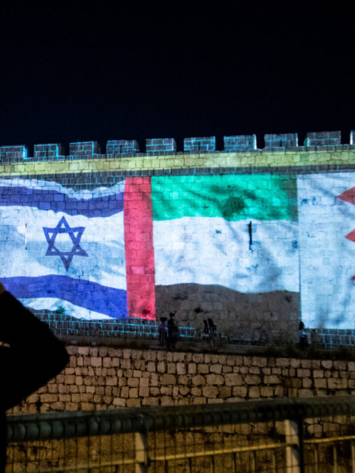 The flags of the US, United Arab Emirates, Israel and Bahrain are screened on the walls of Jerusalem's Old City, on September 15, 2020. Photo by Yonatan Sindel/Flash90