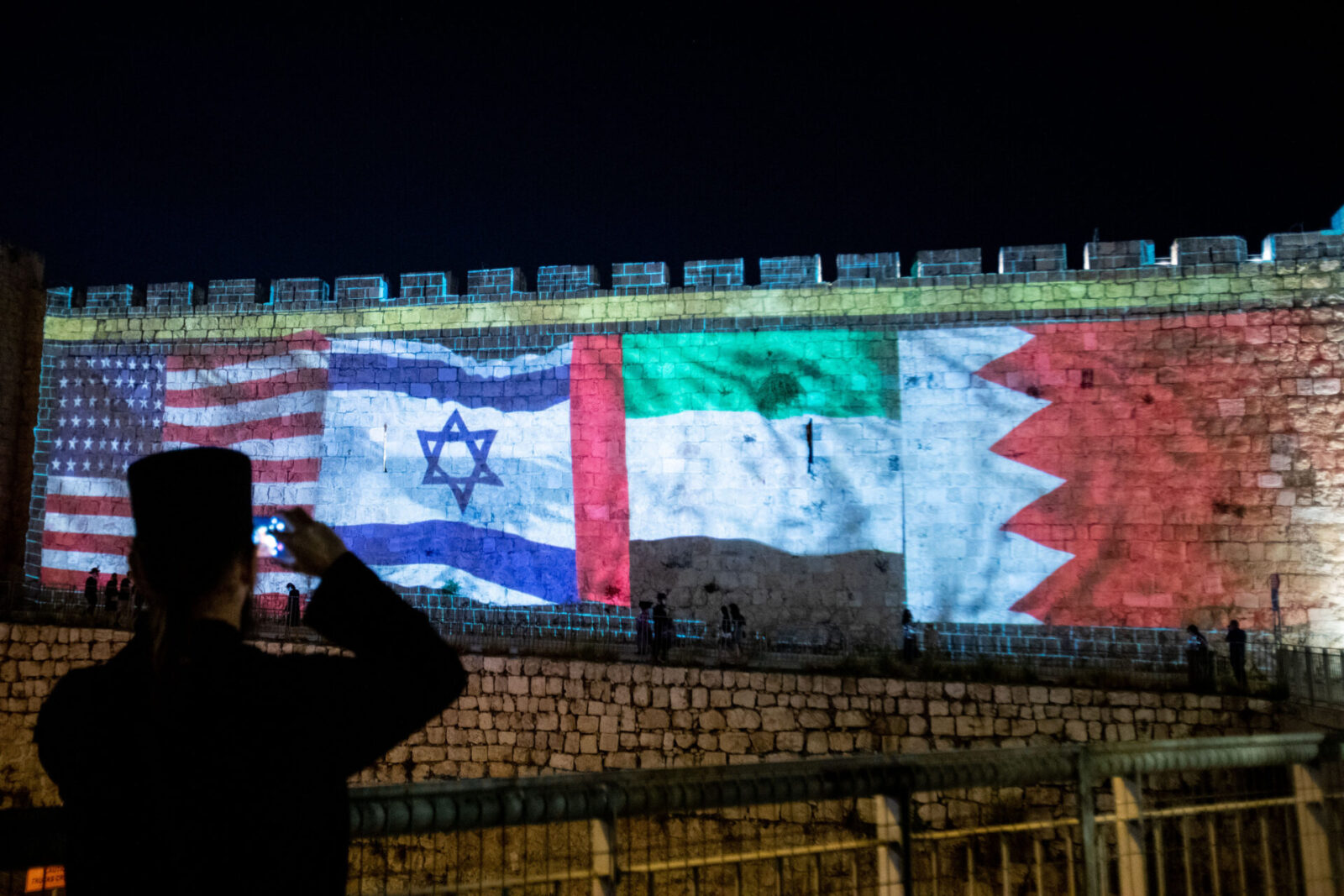 The flags of the US, United Arab Emirates, Israel and Bahrain are screened on the walls of Jerusalem's Old City, on September 15, 2020. Photo by Yonatan Sindel/Flash90