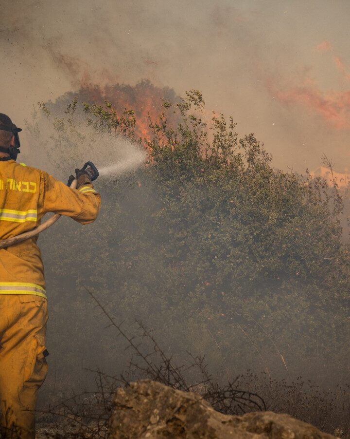 Firefighters extinguishing a forest fire near Jerusalem in November 2019. Photo by Noam Revkin Fenton/Flash90
