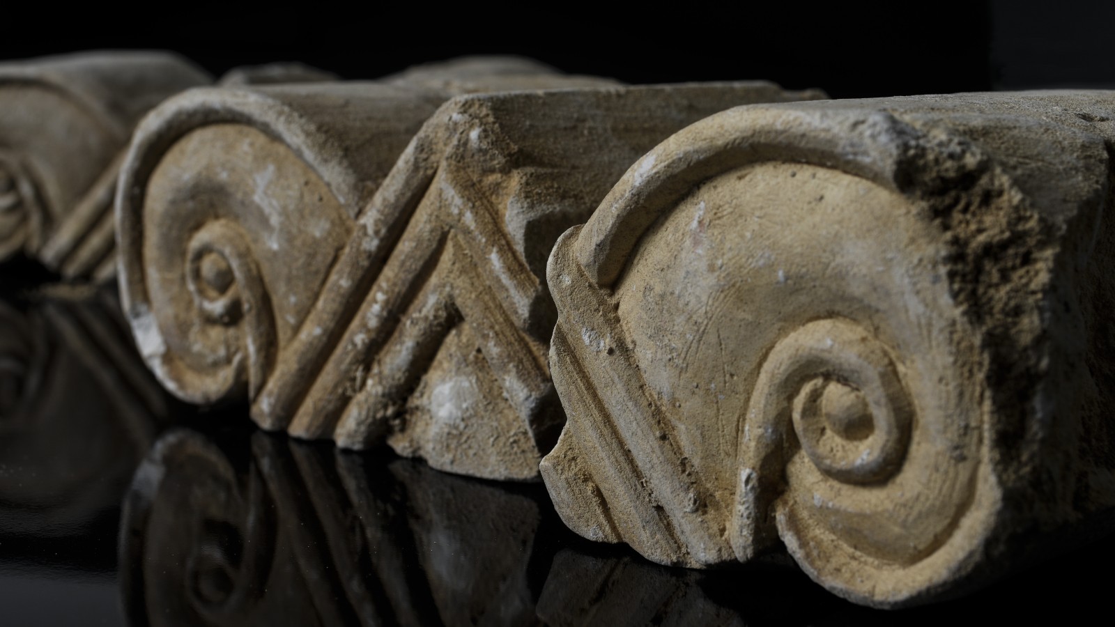 Mini capitals that stood at the top of the columns revealed in the Armon Hanatziv excavation. Photo by Shai Halevi/Israel Antiquities Authority