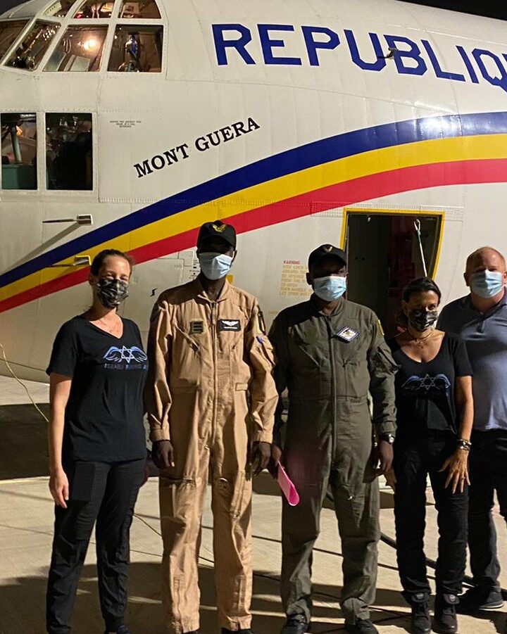From left, Israeli Flying Aid COO Maya Zuckerman; the pilots of the transport plane sent by Chad; IFA CEO Gal Lusky; and Itai Melchior from the Foreign Trade Administration of the Israeli Ministry of Economy and Industry. Photo courtesy of IFA
