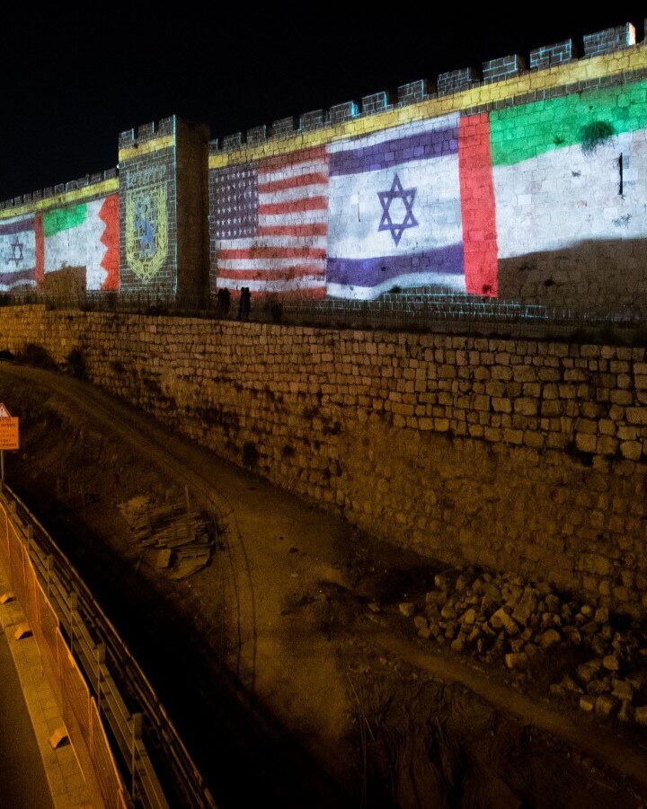 The flags of the US, United Arab Emirates, Israel and Bahrain are screened on the walls of Jerusalem's Old City on September 15, 2020. Photo by Yonatan Sindel/Flash90