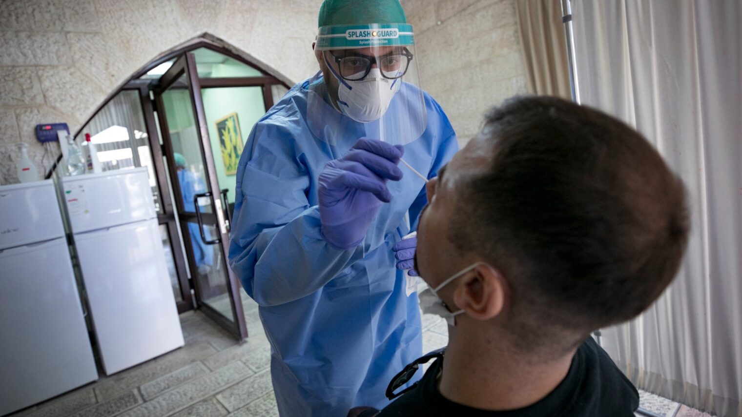 A Jerusalem man getting tested for Covid-19 on October 8, 2020. Photo by Olivier Fitoussi/Flash90