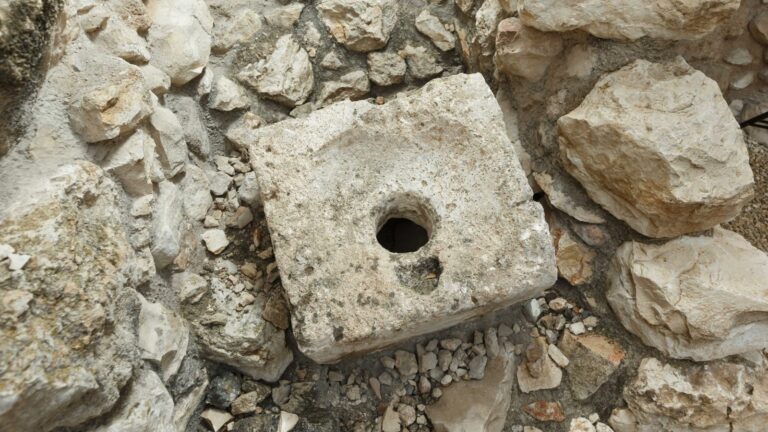 An Iron Age toilet stone uncovered in the City of David in Jerusalem looks remarkably similar to modern-day loos. Photo by Eliyahu Yanai/City of David