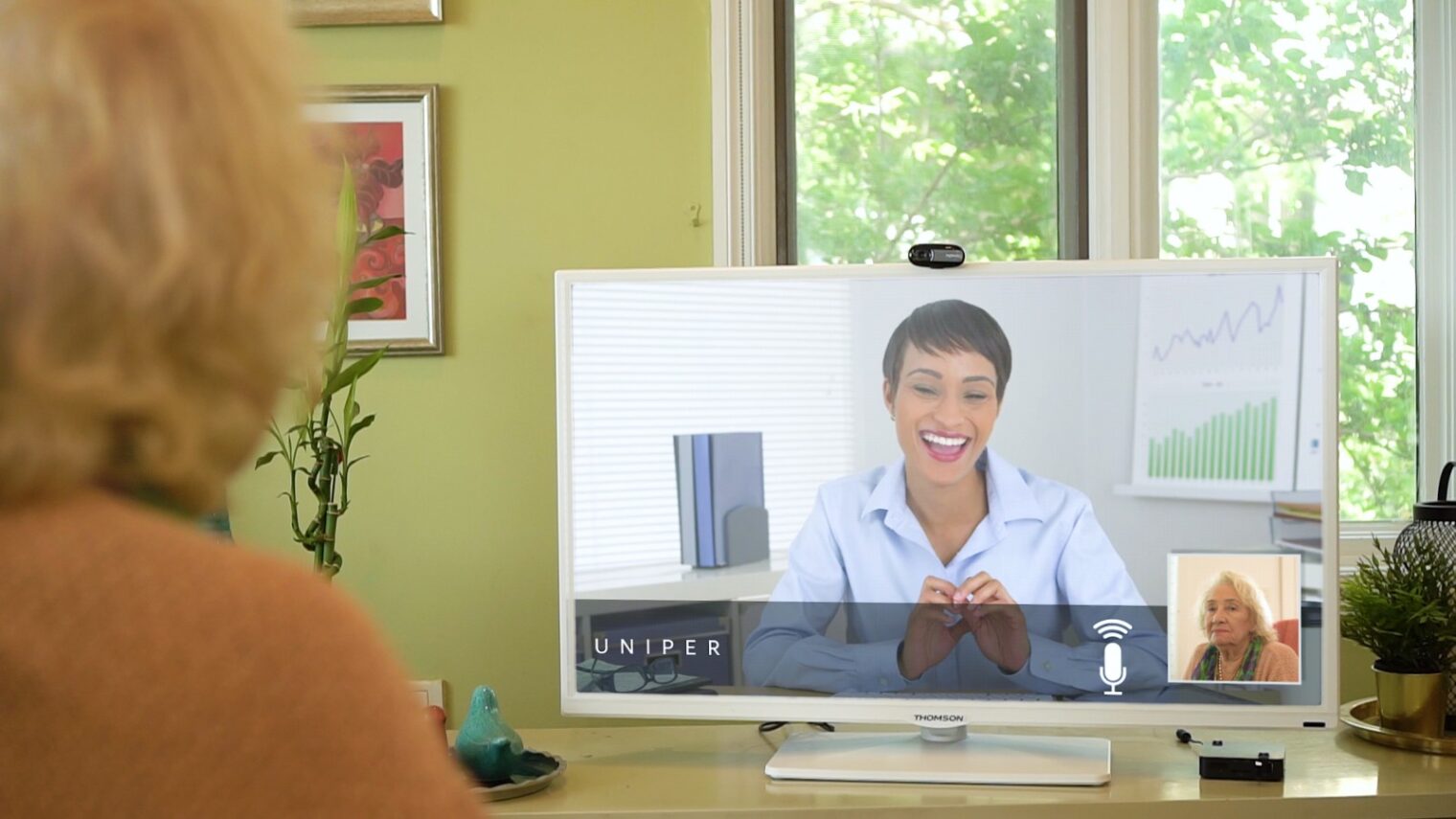 A Uniper Care user interacting with her physician through the television. Photo: courtesy