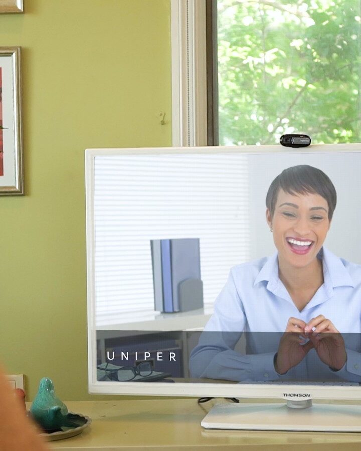 A Uniper Care user interacting with her physician through the television. Photo: courtesy