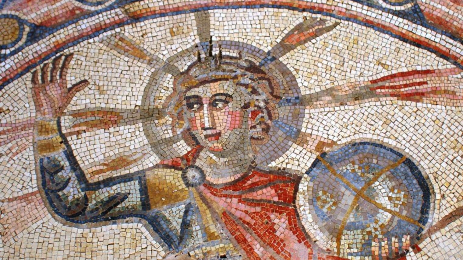 The fourth century mosaic at Severus Synagogue in Hamat Tiberias in northern Israel has three panels – one with Greek inscriptions of its donors’ names; another with a zodiac starring Greek sun god Helios dressed as a haloed emperor surrounded by the star signs and four women symbolizing the seasons; and another showing a tabernacle and other Jewish symbols. Photo by Reuven Riven