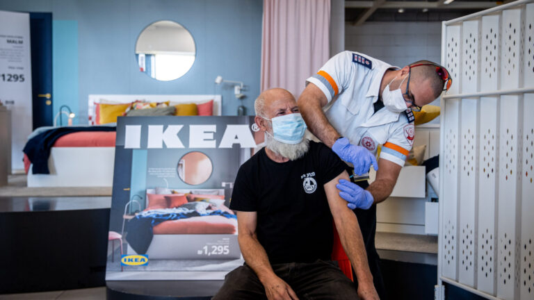 Would you like a sofa with that? Israelis receive a Covid-19 vaccine injection at an IKEA retail store in Rishon le Tzion, February 22, 2021. Photo by Yonatan Sindel/Flash90