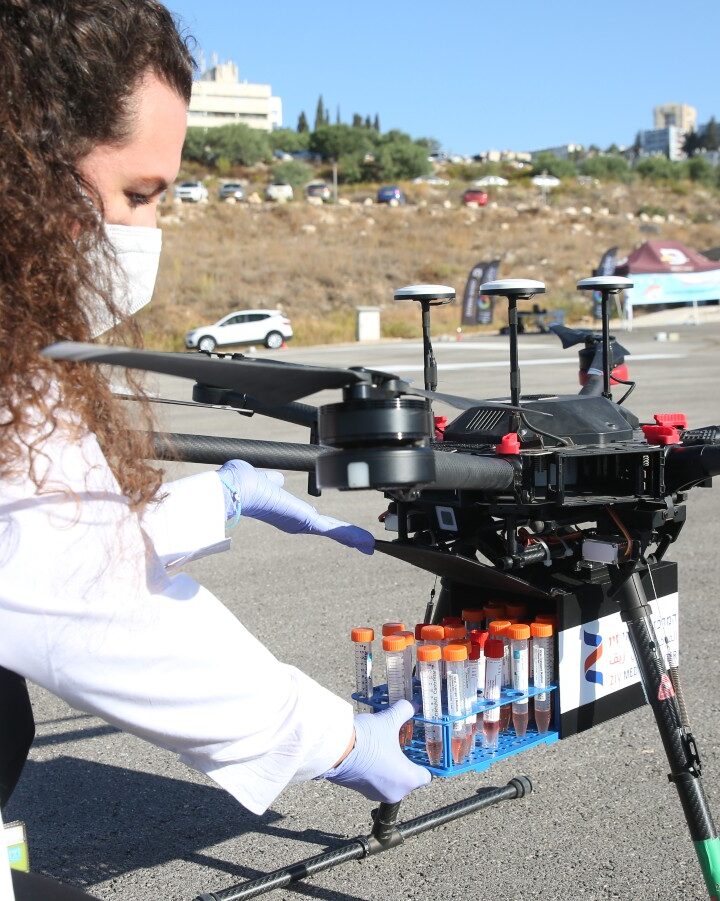 A medical worker loading coronavirus samples on a drone at Ziv Medical Center in Safed on October 18, 2020. Photo by David Cohen/FLASH90