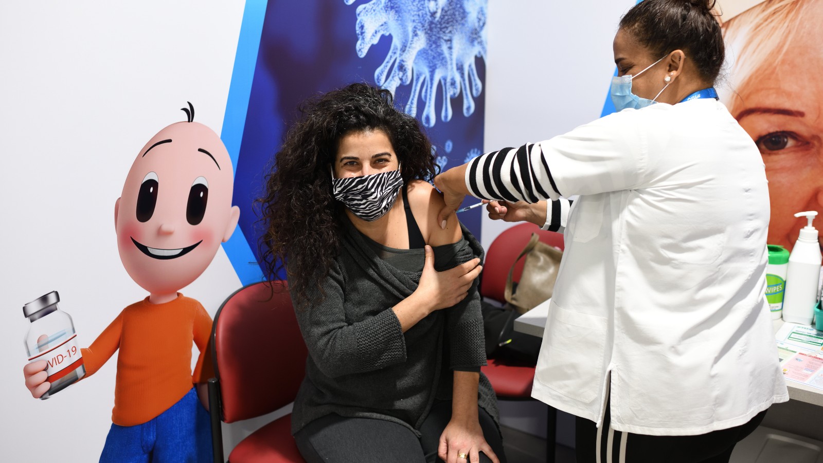 An Israeli woman receives a Pfizer-BioNtech Covid-19 vaccine on February 7, 2021, in Hadera. Photo by Gili Yaari/Flash90