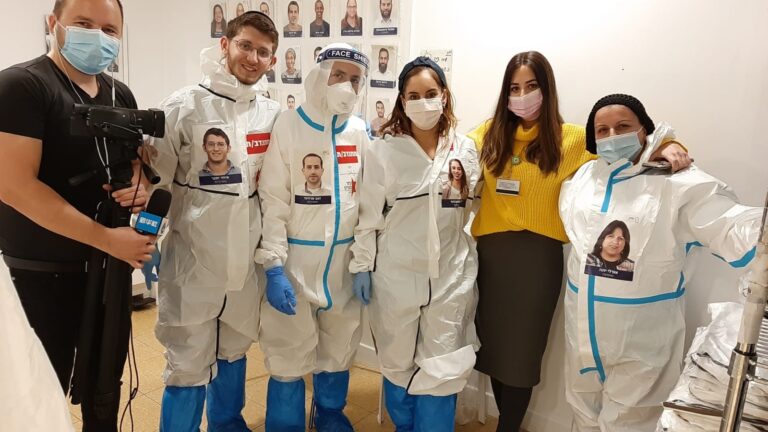 Project coordinator Noa Pakter, in yellow, and recovered coronavirus volunteers being interviewed by the Chinese media at Sheba Medical Center in Ramat Gan, Israel. Photo courtesy of Sheba Medical Center