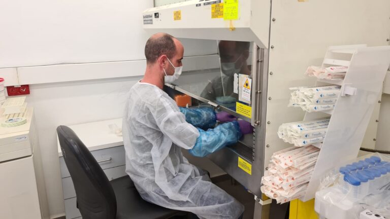 A PeptiCov employee working to find a peptide that fights Covid-19. Photo courtesy of Pepticom