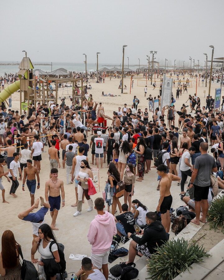 Israelis are returning to public places – like this beach in Tel Aviv -- after more than half the population is vaccinated. Photo by Noam Revkin Fenton/Flash90