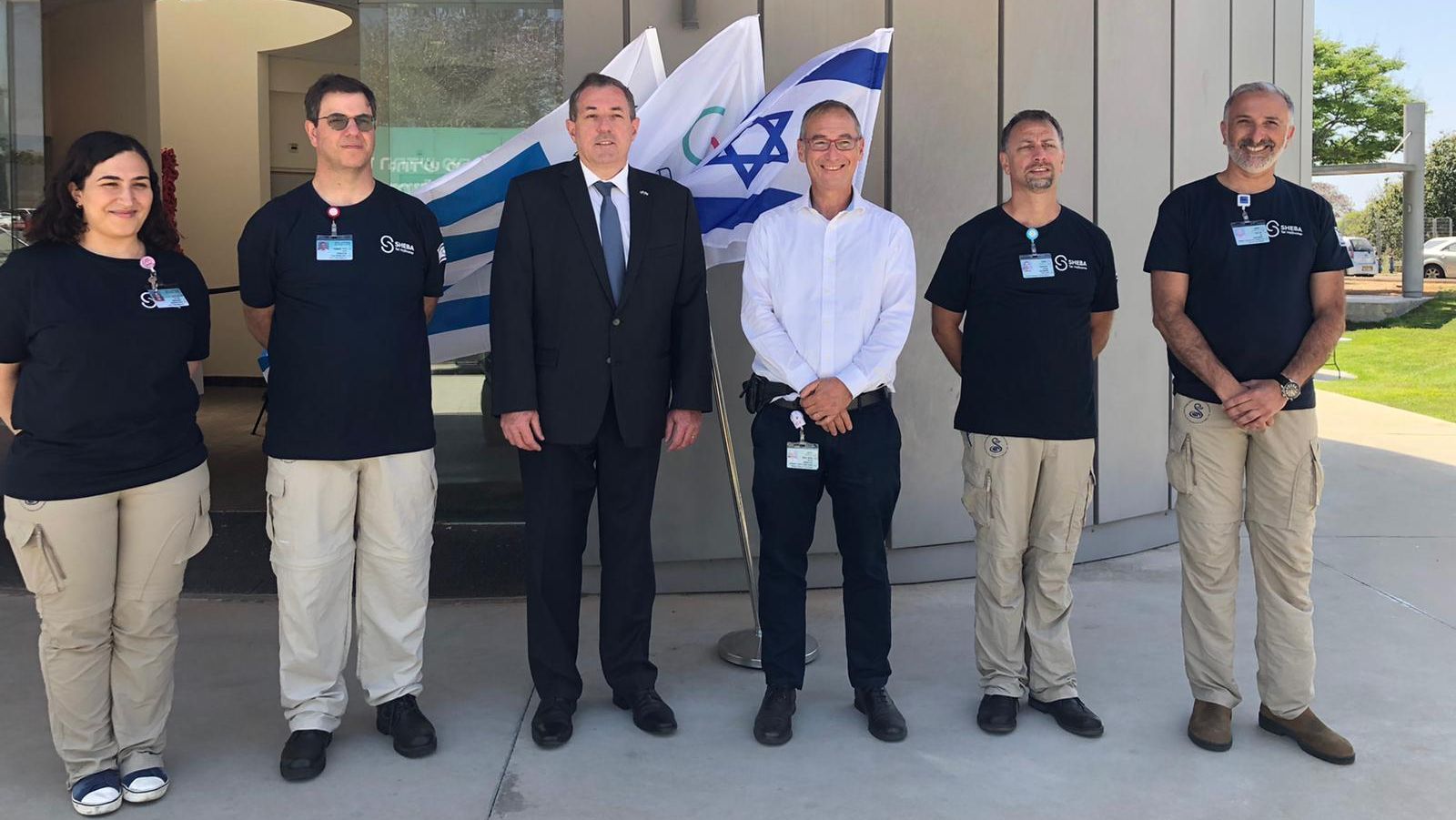 Ambassador of Uruguay to Israel Bernardo Griever (in suit) wishes the Sheba Medical Center team traveling to his home country a successful journey. Alongside him is Prof. Arnon Afek, the deputy director general of the hospital. (Courtesy Sheba Medical Center)