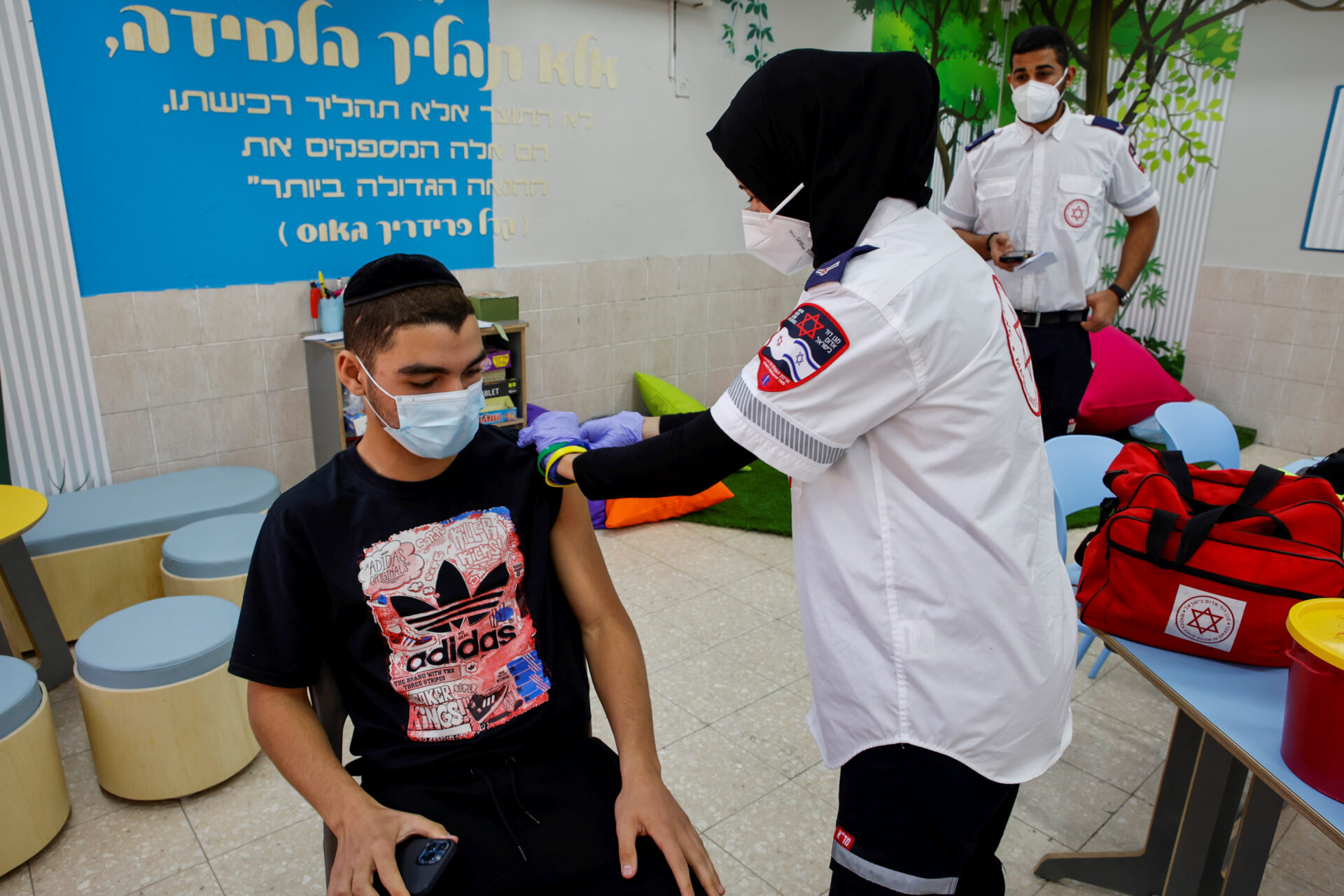 Israeli students at a school in Beersheva receive the Covid-19 vaccine injection. Photo by Flash90