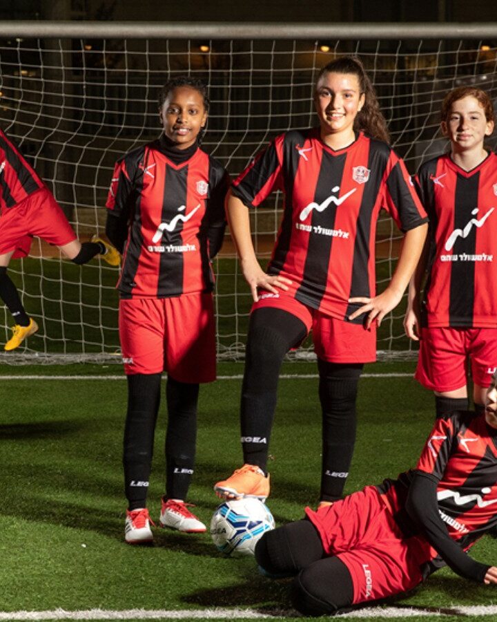 “Kicking Conventions to the Curb” depicts members of Jerusalem’s first soccer club for girls, Hapoel Katamon. Photo by Yoav Alon featured in Hamsa Aleinu