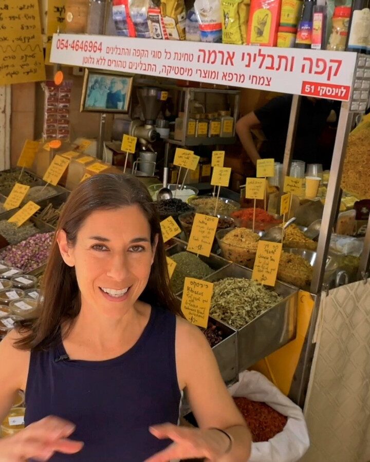 Inbal Baum of Delicious Israel explores the tastes of Levinsky Market. Screenshot by Haim Silberstein