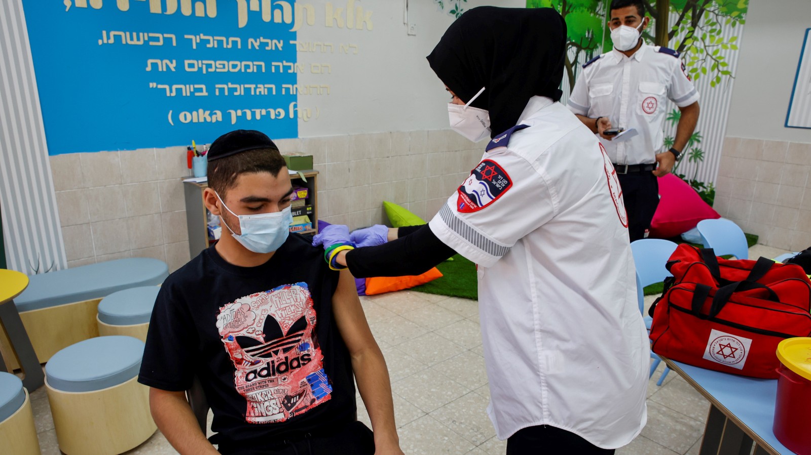 An Israeli student receiving his Covid-19 vaccine at Amal High School in  Beersheva, March 17, 2021. Photo by Flash90